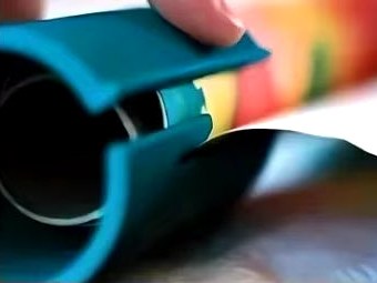 Feed the paper into the slit